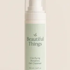 100ml airless pump bottle of Beautiful Things Clarifying Botanics Gel Cleanser with a pastel green label and botanical branding.